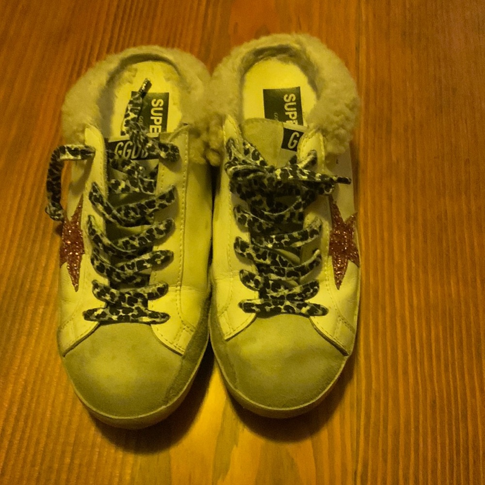 Golden goose slips size 38.5 with cheetah print laces and pink sparkle star.